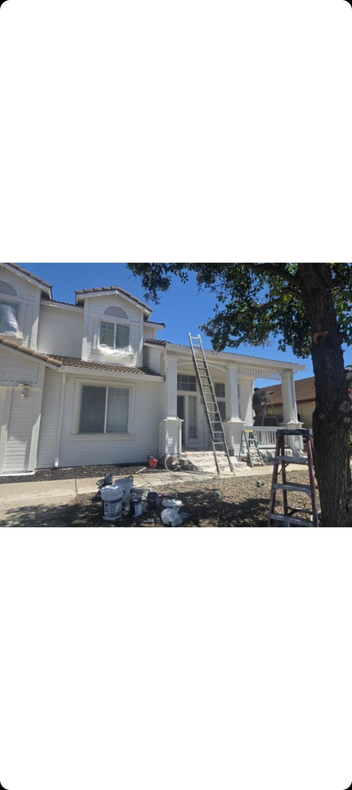 Two-story home exterior repaint